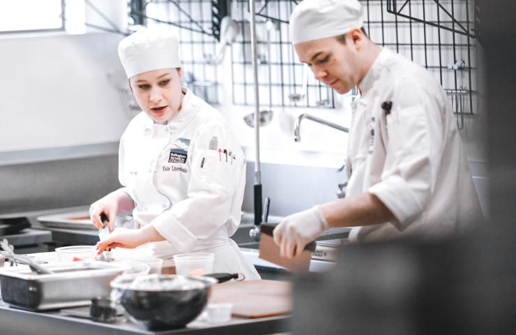 Two people in kitchen