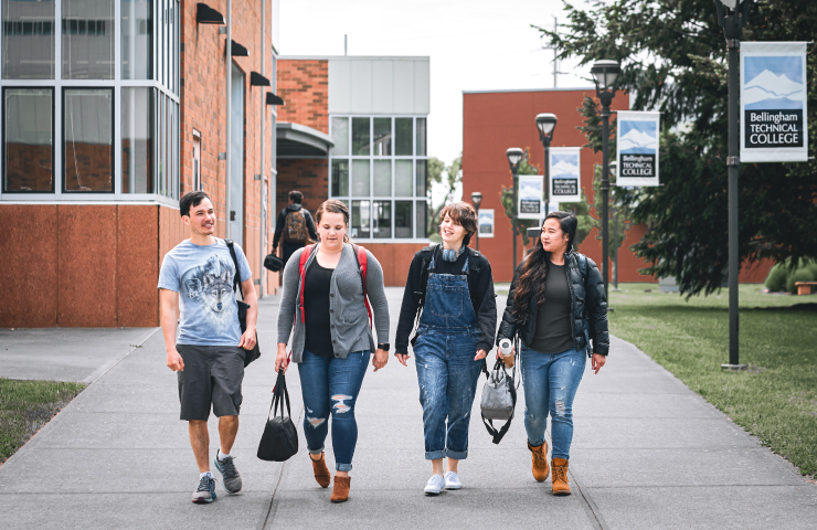 Four people walking