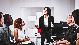 Woman talking to a group of people