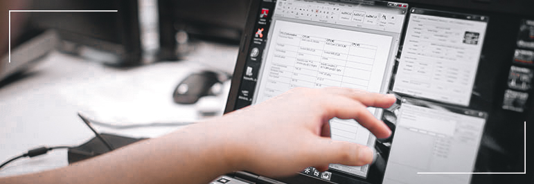 Person pointing to a computer screen